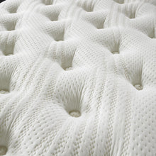 Close-up of hand-tied tufts on the soft knitted cover of the Cashmere mattress