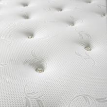 Close-up of hand-tied tufts and silver swirl jacquard on the Forrest mattress