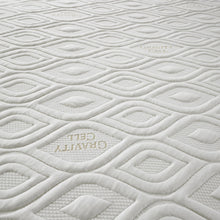 Close-up of the ogee quilting with woven Gravity Cell lettering on the mattress cover