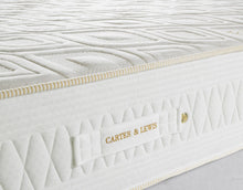 Gravity Cell mattress border with gold rope piping, quilted side panel and branded handle