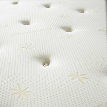 Close-up of hand-tied tufts and gold star motifs on the Memory Collection mattress
