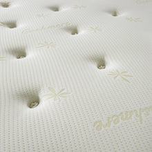 Close-up of hand-tied tufts and gold star motifs on the Memory Ortho mattress