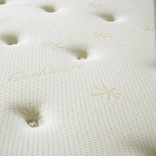 Close-up of hand-tied tufts and gold star embroidery on the Memory Plus mattress