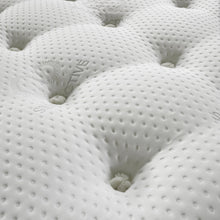 Close-up of deep hand-tied tufts on the Natural Comfort mattress with natural fillings