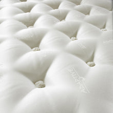 Close-up of deep hand-tied wool tufts on the Sleep Adaptive mattress