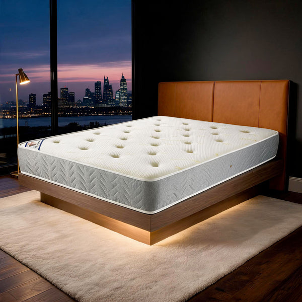 Carter & Lewis Memory Ortho mattress with grey border on a tan leather bed in a London apartment at dusk