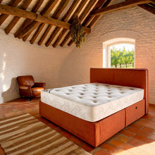 Carter & Lewis Memory Plus Pocket mattress on a terracotta ottoman bed in a beamed English cottage bedroom