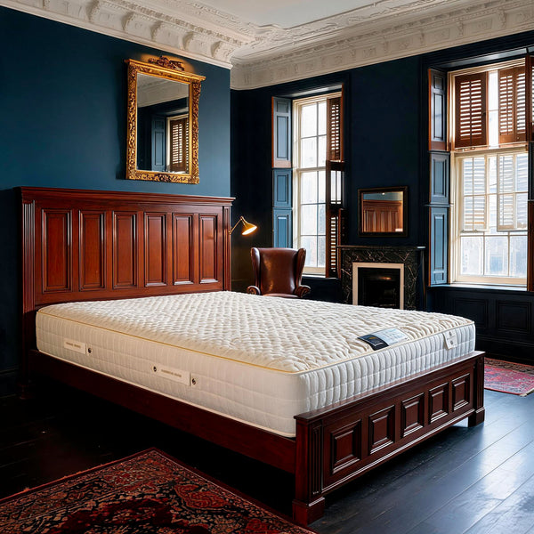 Carter & Lewis Reeves pocket sprung mattress on a mahogany panelled bed in a navy Edinburgh townhouse bedroom