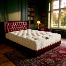 Carter & Lewis Sleep Master hand-tufted mattress on an oxblood leather chesterfield bed in a panelled bedroom